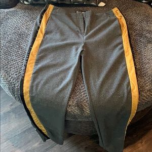Gray work pants with a yellow & black streak
